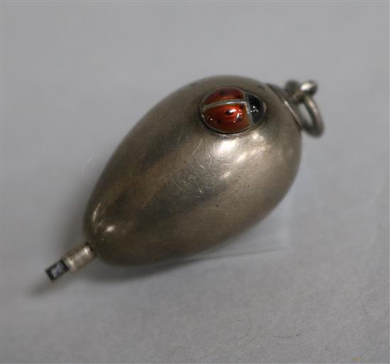 A late 19th/early 20th century 800 standard silver novelty ovoid propelling pencil with enamelled ladybird appliqué, 26mm.